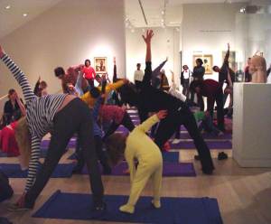 Families enjoy yoga in the galleries