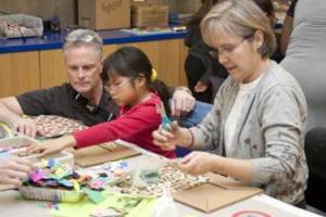 Visitors exploring art materials in the Studio