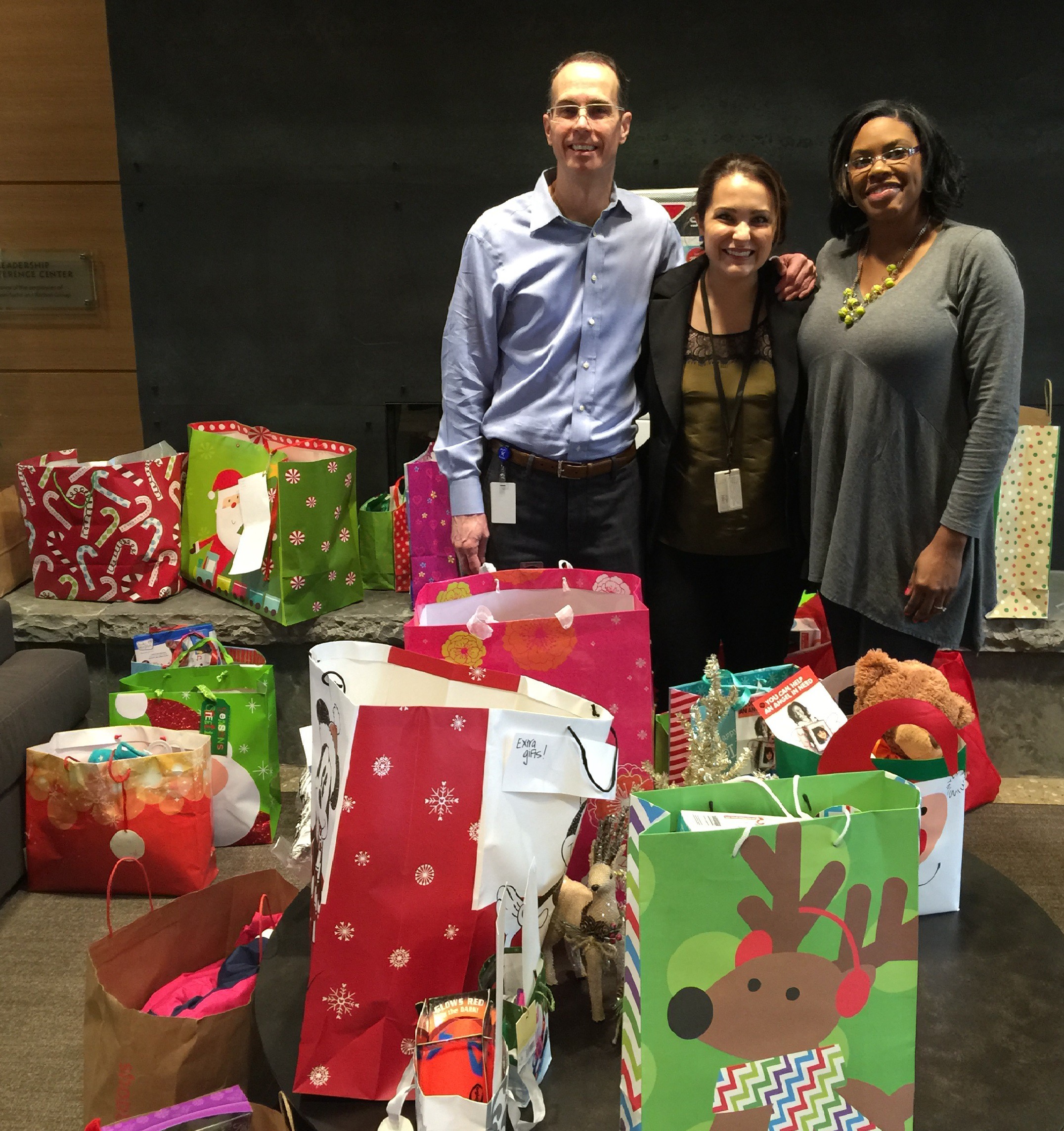 Andrea dropping off gifts with CASA Staff