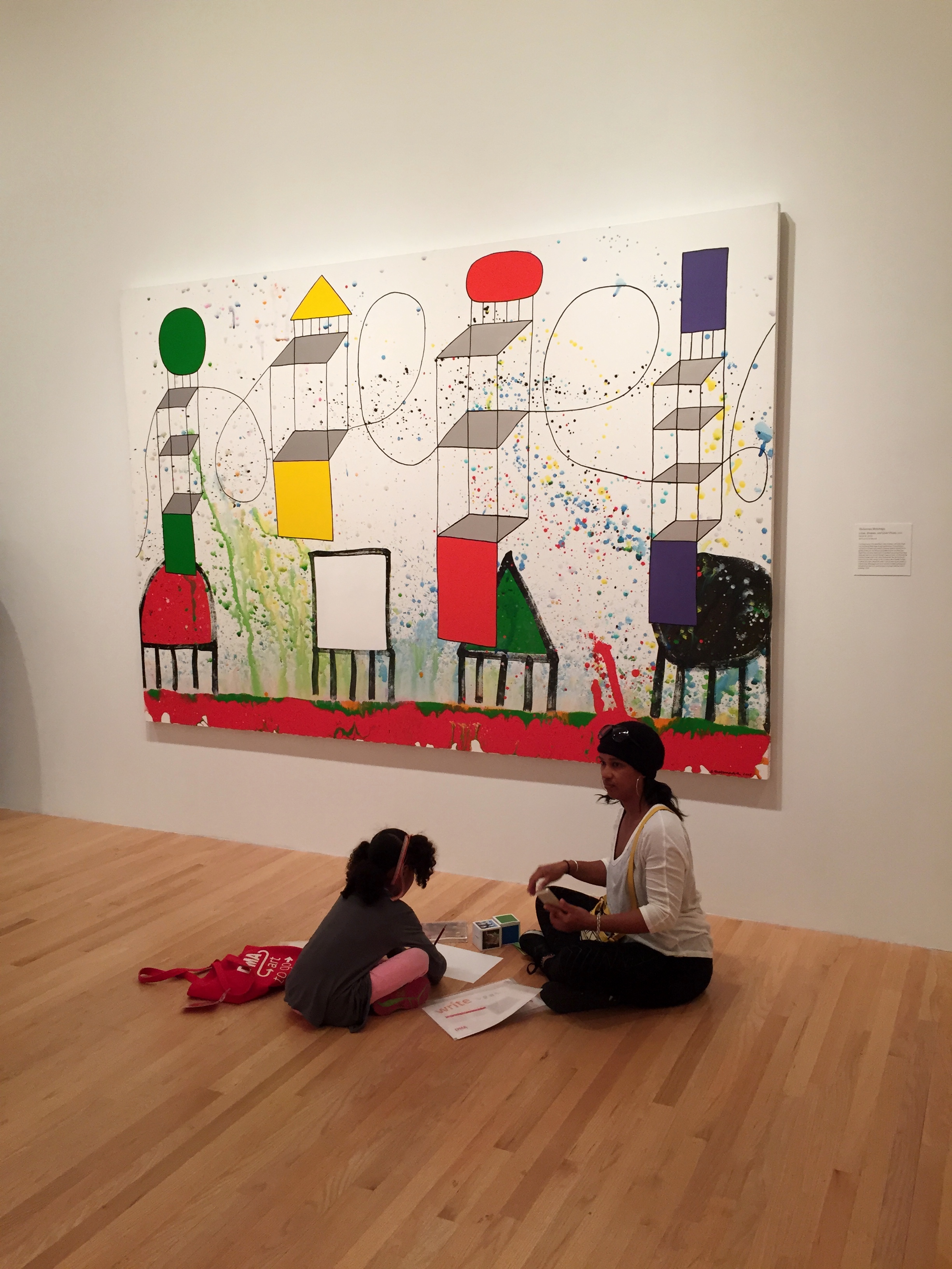 A family using the Color Art to Go Family Tote and story dice in Between Action and the Unknown: Shiraga/Motonaga.