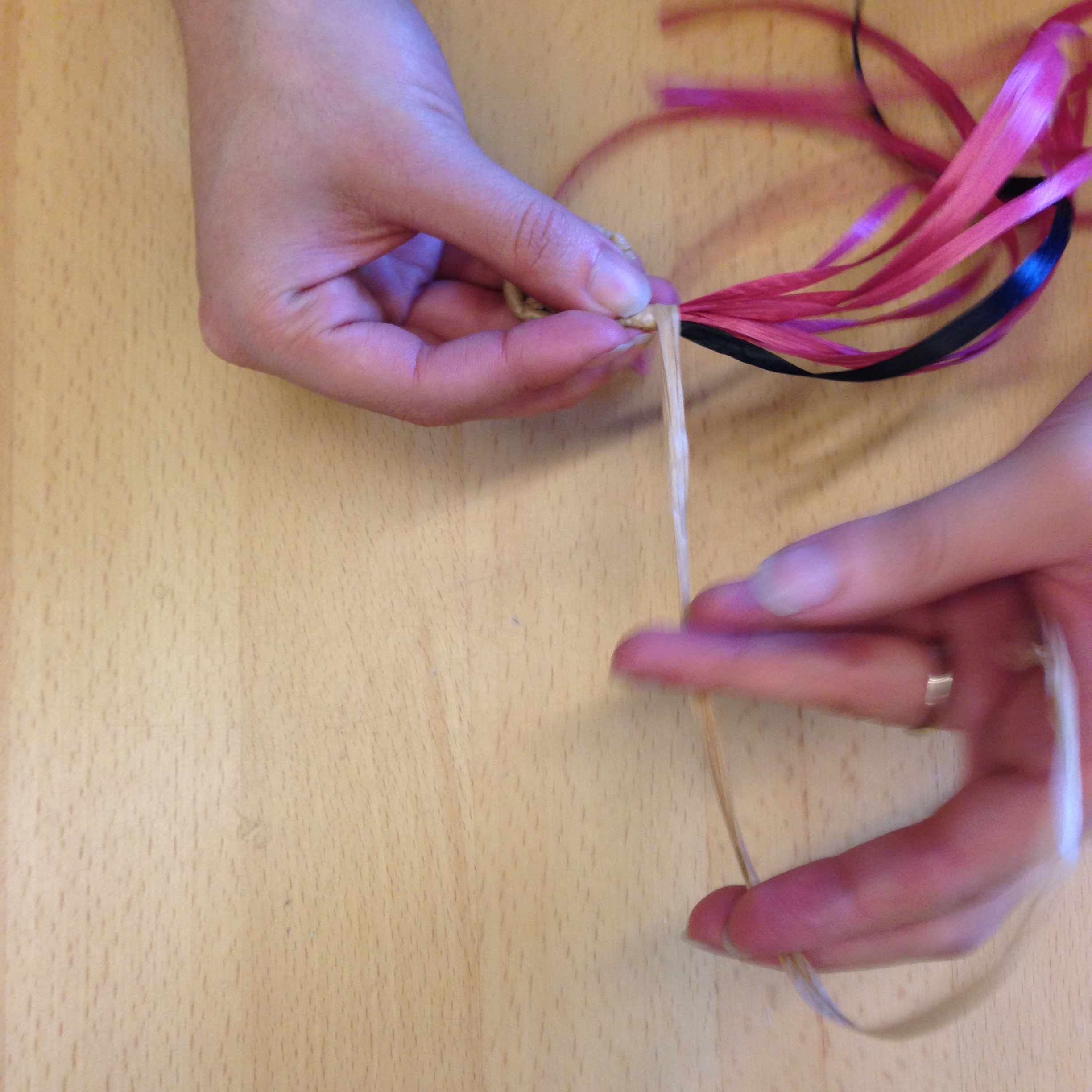 Secure the new strand by wrapping it a few times with the old color strand.