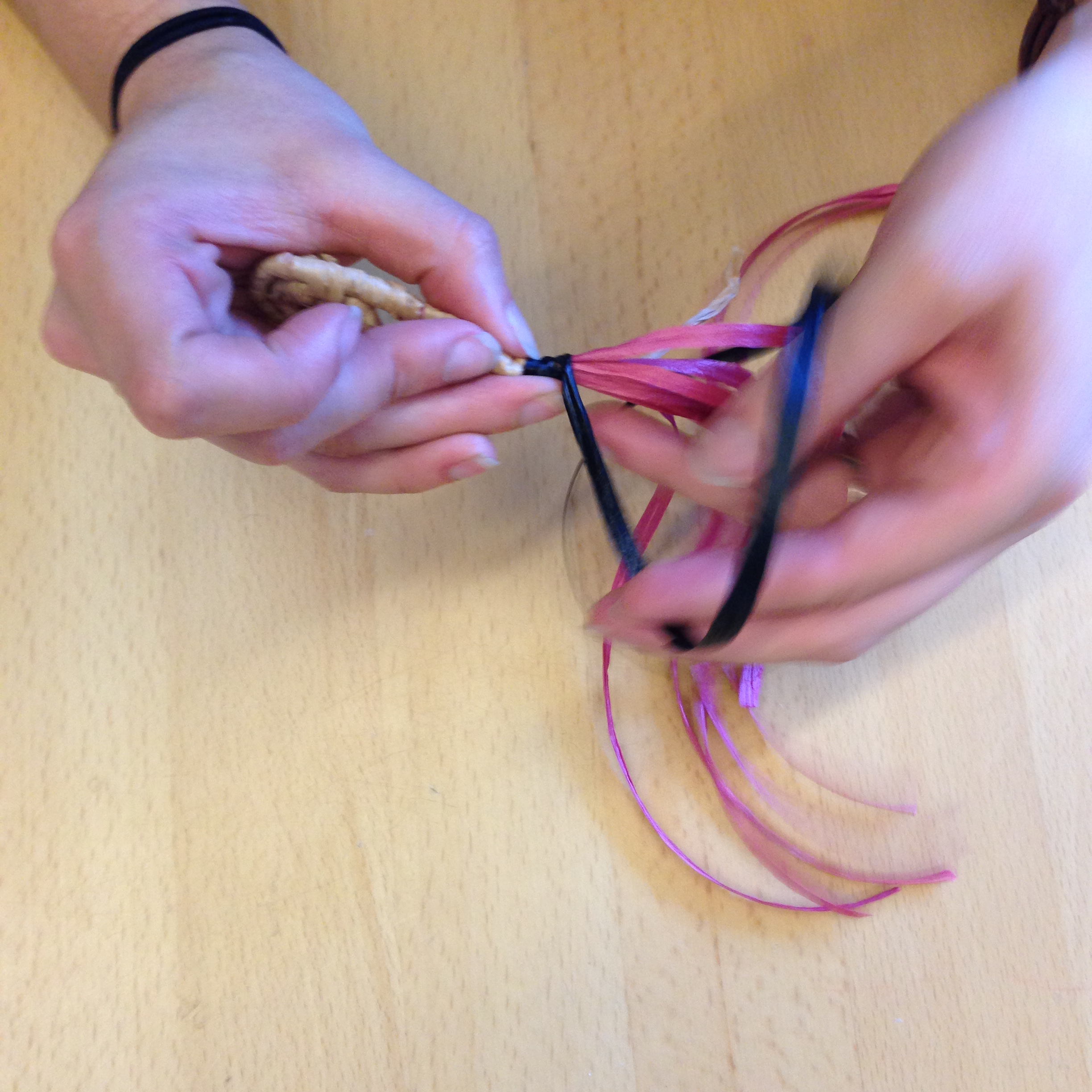 Let the old color strand become part of the red basket core, and use the new color strand to wrap around the basket core.