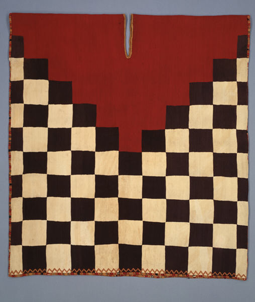 Tunic with checkerboard pattern and stepped yoke