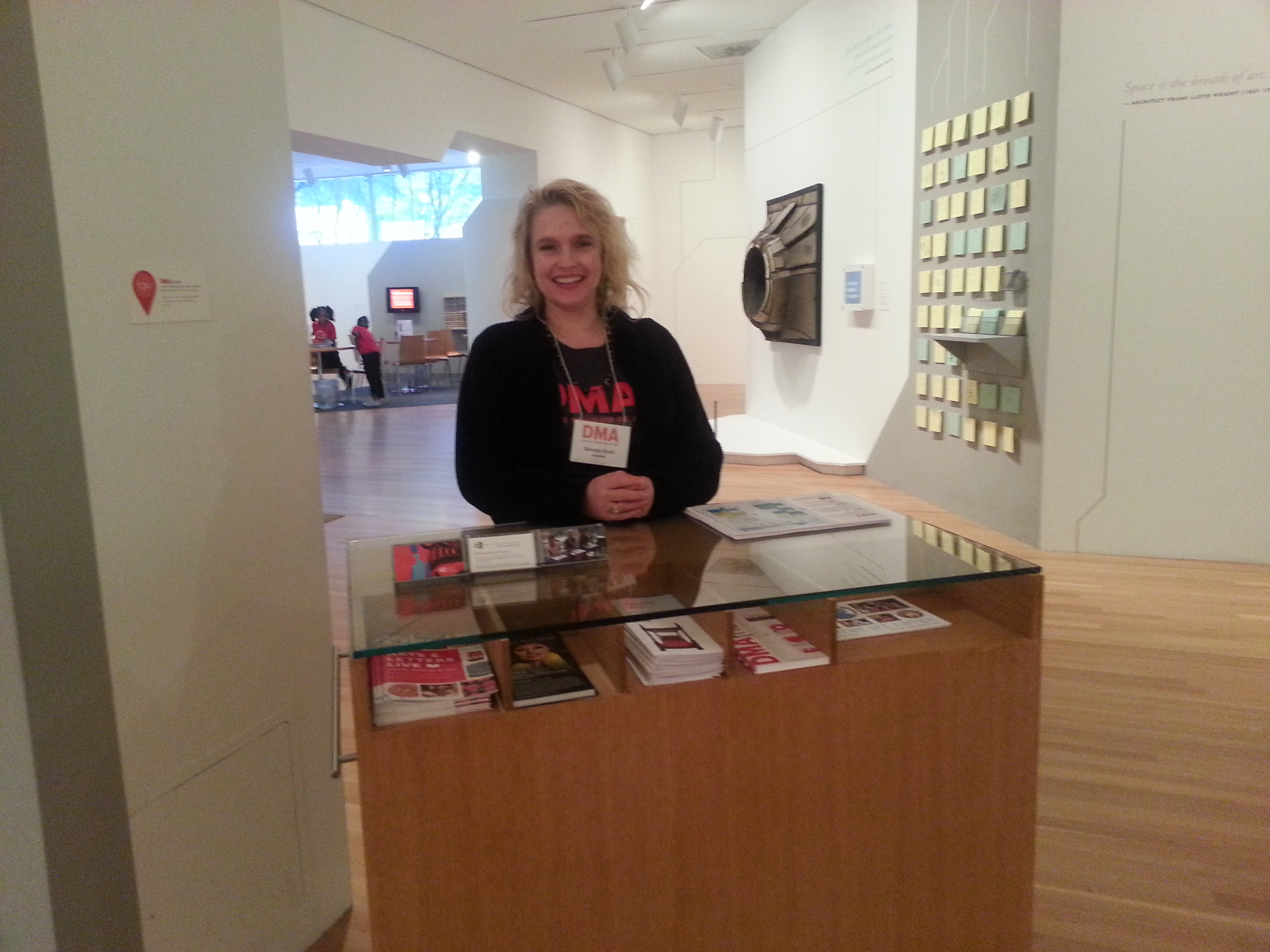 Georgia, a C3 Volunteer, greets visitors as they enter the Center for Creative Connections.