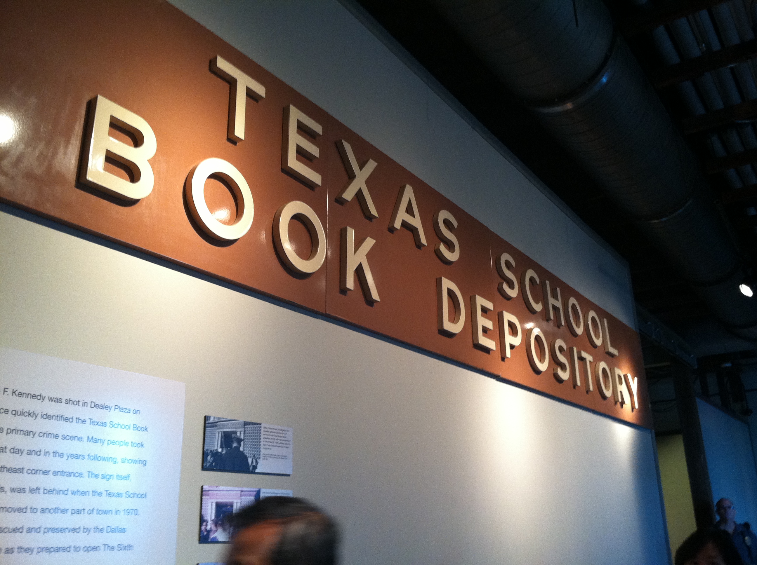The original sign from the Texas School Book Depository on display at The Sixth Floor Museum