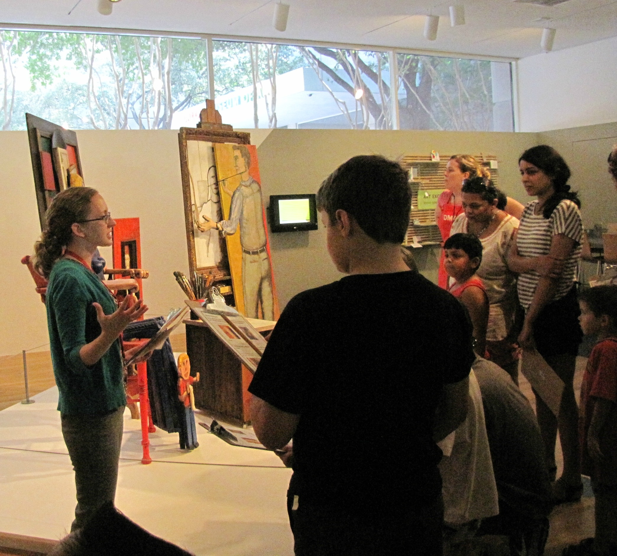 Amy teaching in front of Family Portrait 1963