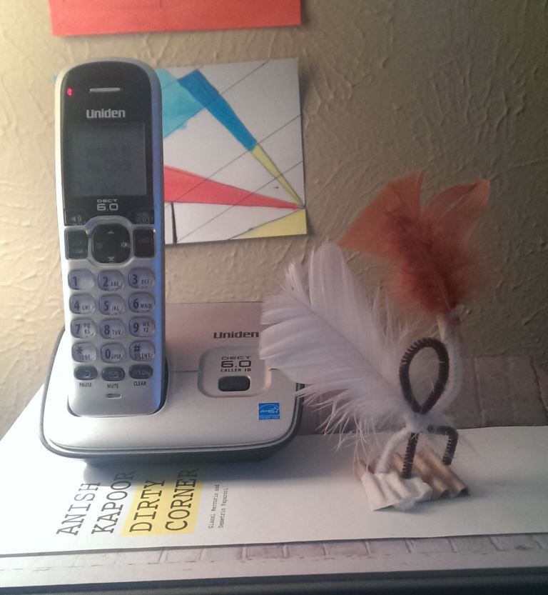 A trinket left by a visitor that I keep by my phone to remind me to be receptive (yes, I still use a home phone)