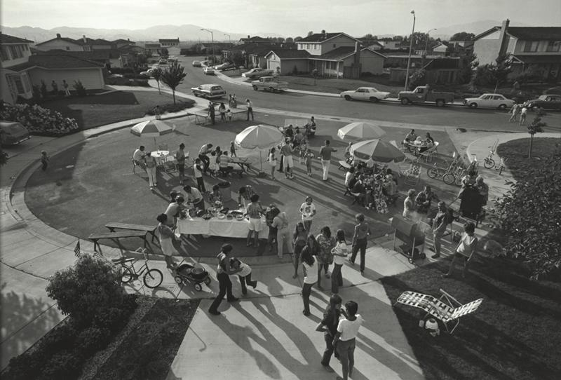 This is our second annual Fourth of July block party. This year thirty-three families came for beer, barbequed chicken, corn on the cob, potato salad, green salad, macaroni salad, and watermelon. After eating and drinking we staged our parade and fireworks., Bill Owens, 1971